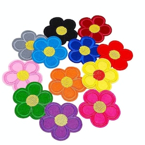 May include: A selection of embroidered flower patches in a range of colours: red, blue, yellow, pink, green, orange, purple, grey, and black. Each patch has a yellow centre. Ideal for embellishing clothing or accessories. The patches are made of fabric.