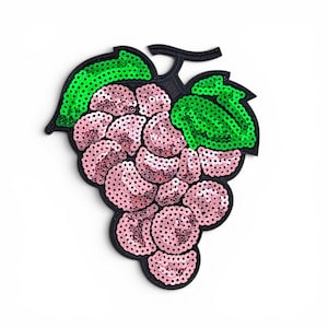 May include: A grape-shaped patch featuring light pink sequins for the fruit and vibrant green sequins for the two leaves. The entire design is outlined with a black border, creating a distinct shape that highlights the individual grape segments.