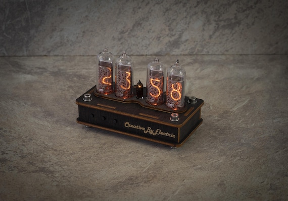 Industrial-styled IN-14 Nixie tube desk clock with a raw cyberpunk aesthetic — handwired and built-to-order by a single maker.