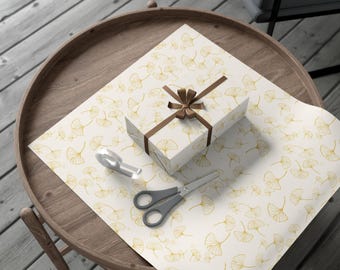 Inpakpapier met ginkgobladeren, elegante botanische cadeauverpakking, goudbotanisch ontwerp, luxe verpakking