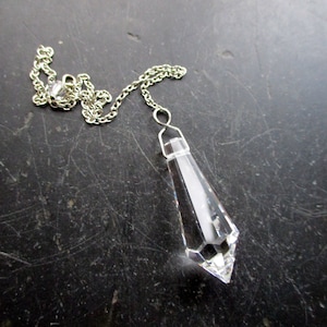 Pendulum, pointed pendulum, faceted, crystal glass, shimmering, metal, Wicca