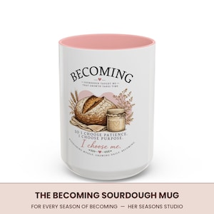 May include: A white ceramic mug with a soft pink interior featuring a graphic of a sourdough loaf and a glass jar. The text reads: BECOMING, SOURDOUGH TAUGHT ME THAT GROWTH TAKES TIME, SO I CHOOSE PATIENCE. I CHOOSE PURPOSE. I choose me.