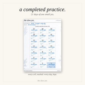 May include: A white paper tracker titled the slow yes. with 21 numbered cells, each filled with a date and a blue ink checkmark. The header reads a completed practice. 21 days of one small yes. and the goal is written as Read 3 pages every day.