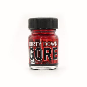 May include: A small glass bottle with a black cap, filled with a red liquid. The label reads "DIRTY DOWN GORE" in bold white letters. The bottle contains 15ml / 0.5 fl oz of product.