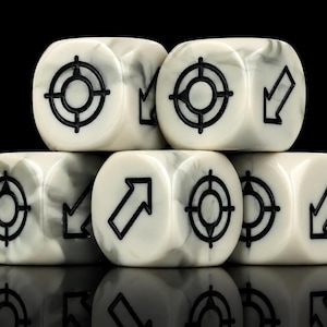 May include: Five six-sided dice with a white and gray marbled finish. Each face features a black engraved design, either a circular target symbol or a directional arrow pointing in various orientations, arranged in a stacked pyramid formation.