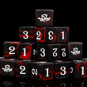 May include: A pyramid stack of square dice featuring a black and red marbled pattern. Each die face displays a white numeral or a white graphic symbol resembling a stylized lightning bolt or burst. The dice are arranged in a tiered formation.