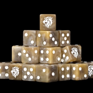 May include: A pyramid stack of beige and brown marbled dice with white pips. Several dice feature a white lion head logo on one face. The dice are arranged in a tiered formation, showcasing various numerical sides and the lion emblem clearly.
