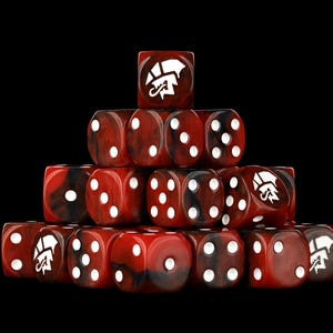 May include: A pyramid stack of red and black marbled six-sided dice against a black background. Each die features white pips and a white custom logo on one face, depicting a stylized helmeted figure. The dice are arranged in a triangular formation.