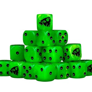May include: A pyramid of bright green dice with black pips and a black graphic. The dice are stacked on a white background. The graphic appears to be a stylized image of a creature.
