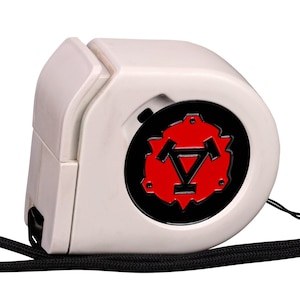 May include: A white retractable tape measure featuring a circular black and red emblem on the side. The device includes a black wrist strap attached to the side, and the casing has a smooth, rounded design with a slot for the tape to extend.