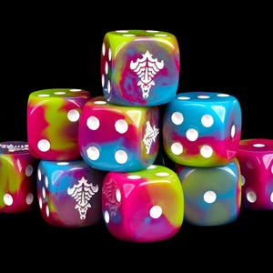 May include: A collection of multi-colored six-sided dice featuring a swirl of bright pink, lime green, and cyan blue. Each die has white pips, and some faces display a white graphic symbol resembling a stylized skull or crest design.
