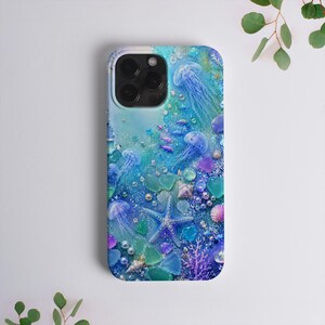 May include: A smartphone case featuring a vibrant underwater scene with multiple translucent blue jellyfish, a central blue starfish, scattered sea glass pieces, small white pearls, and purple coral accents against a gradient blue background.