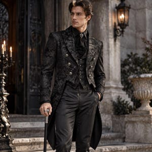 May include: A black brocade tailcoat jacket featuring a double-breasted front with silver buttons, worn over a matching waistcoat and a black shirt with a ruffled jabot. The ensemble includes plain black trousers and a silver-topped walking cane.