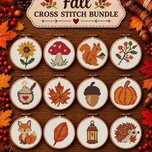 May include: A Fall Cross Stitch Bundle featuring twelve circular wooden embroidery hoops. Each hoop contains a cross-stitched design including a sunflower, mushroom, squirrel, berries, mug, leaf, acorn, pumpkin, fox, leaf, lantern, and hedgehog.
