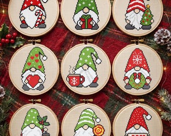 May include: Nine circular wooden embroidery hoops containing cross-stitch patterns of Christmas gnomes. Each gnome features a unique hat design and holds a festive item, including a candy cane, gift, tree, heart, mug, wreath, lantern, lollipop, or sign reading JOY.