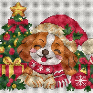 May include: A cross-stitch pattern featuring a brown and white puppy wearing a red Santa hat and a red scarf with white snowflake details. The puppy is surrounded by a green Christmas tree with a yellow star, red gift boxes, and a red ornament.