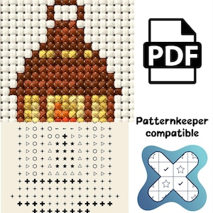 May include: A cross-stitch pattern featuring a brown lantern with yellow light and orange flames. Below the stitched design is a grid of black symbols including plus signs, triangles, circles, and stars. Includes a PDF icon and text reading Patternkeeper compatible.