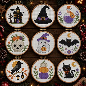 May include: Nine circular wooden embroidery hoops containing cross-stitch patterns featuring Halloween themes including a haunted house, witch hat, potion bottle, skull with flowers, ghost, bat, crow, stacked pumpkins, and a black cat.