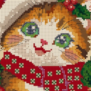 May include: A cross-stitch pattern featuring a close-up of a cat face with orange fur, green eyes, and a pink nose. The cat wears a red scarf with a green and white geometric pattern, and there are green holly leaves visible at the top right.