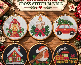 May include: A Christmas cross stitch bundle featuring six wooden embroidery hoops with holiday designs: a lantern, a candle, a car with a tree, a house, a robin, and a train. The text reads Christmas CROSS STITCH BUNDLE.