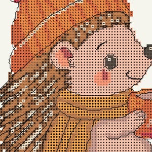 May include: A cross-stitch pattern featuring a hedgehog wearing an orange hat and a yellow scarf. The design uses a grid of symbols to represent colors, including shades of brown for the quills, light pink for the face, and orange for the hat.