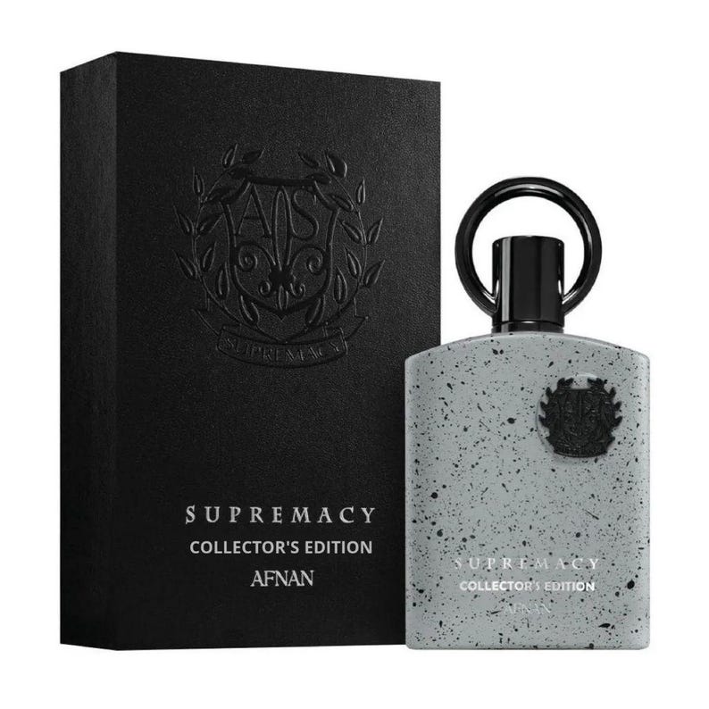 Puede incluir: Frasco y caja de perfume Afnan Supremacy Collector's Edition. El frasco es gris con motas negras y un tap&oacute;n negro. La caja es negra con texto en relieve y un logotipo. El texto en la caja y el frasco dice "SUPREMACY COLLECTOR'S EDITION AFNAN."