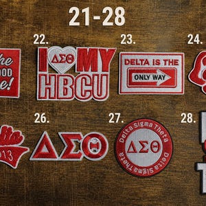 May include: A collection of red and white embroidered patches with various designs and text. The patches include phrases like "It's the Sisterhood for me!" and "Delta is the Only Way." Other patches feature Greek letters and the words "Diva" and "since 1913."