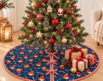 May include: A round navy blue Christmas tree skirt featuring a repeating pattern of small robins and red berries, finished with a red and white striped trim and three matching bows along the front opening, placed under a decorated tree.