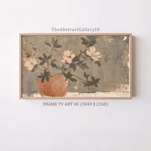 May include: A framed digital artwork titled TheAbstractGalleryID featuring a potted plant with light-colored flowers and dark leaves against a muted gray background. The text FRAME TV ART 4K (3840 X 2160) is printed below the rectangular frame.