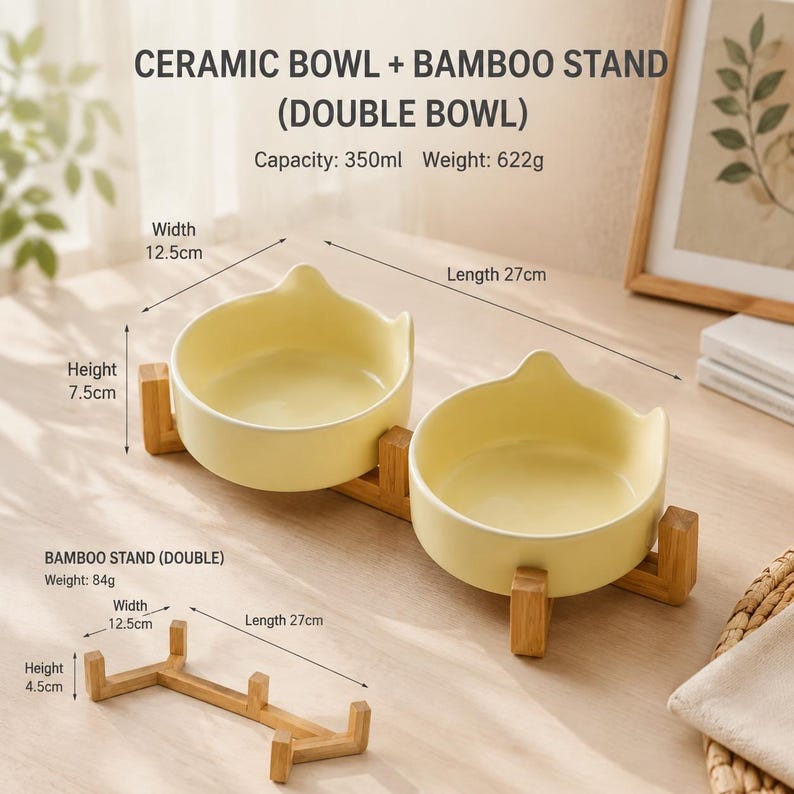 May include: Two pale yellow ceramic bowls with cat-ear shaped rims set on a bamboo stand. Text indicates a 350ml capacity and 622g weight. A separate bamboo stand is shown with dimensions of 12.5cm width, 27cm length, and 4.5cm height.