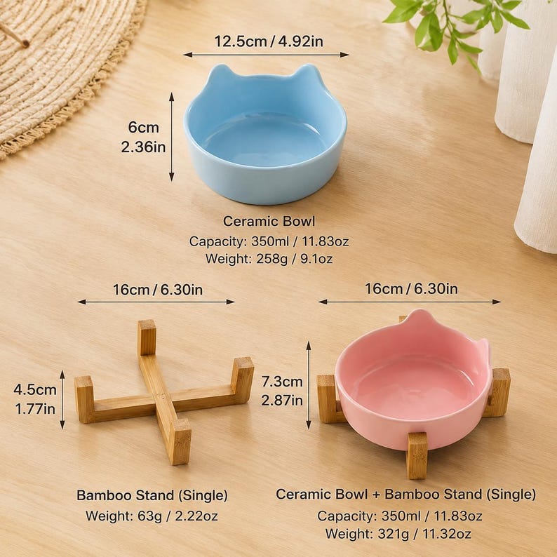 May include: A light blue ceramic bowl with cat-ear shaped rims, a pink ceramic bowl with cat-ear shaped rims, and a bamboo stand. The blue bowl is 4.92 inches wide and 2.36 inches high. The bamboo stand is 6.30 inches wide and 1.77 inches high.