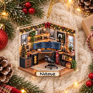 May include: A hexagonal Christmas ornament featuring a miniature 3D office scene with a computer desk, three monitors, a gaming chair, shelves, and a small Christmas tree. The base of the ornament has a rectangular plaque with the text Name.
