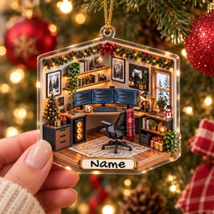 May include: A hexagonal acrylic Christmas ornament featuring a miniature 3D office scene with three computer monitors, a desk, a chair, and holiday decorations. The ornament includes a gold hanging loop and a plaque at the bottom with the text Name.