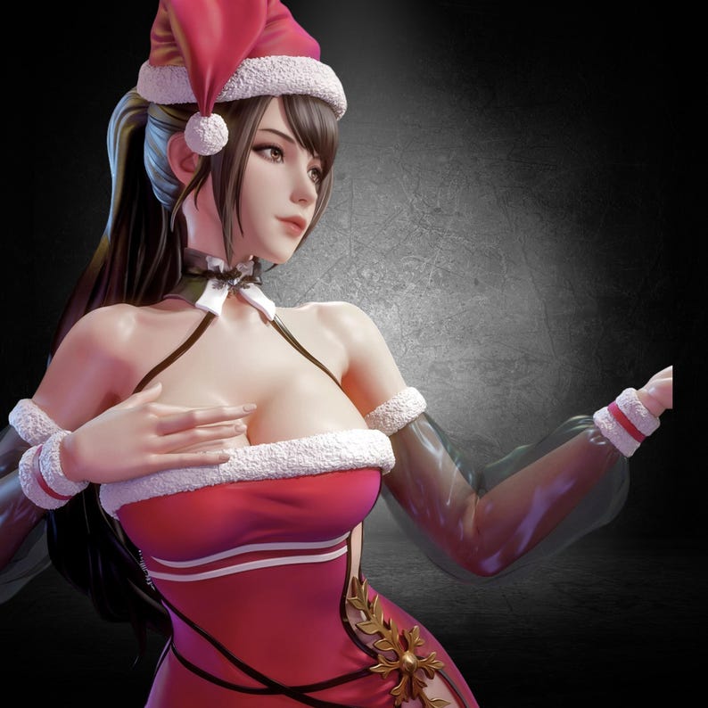 以下が含まれることがあります： 赤いドレスとサンタ帽をかぶった女性のフィギュア。ドレスは白いフェイクファーのトリムと金のアクセントが付いています。白いリボンが付いた黒いチョーカーを着用しています。背景はグレーと黒のグラデーションです。