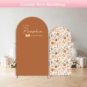 May include: Two arched backdrops for events. The left backdrop is solid burnt orange with the text A LITTLE Pumpkin IS ON THE WAY! and a small pumpkin graphic. The right backdrop features a repeating pattern of pumpkins and autumn leaves.