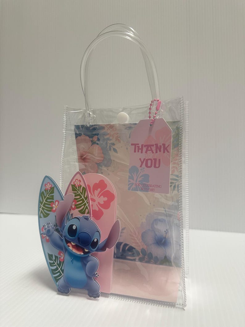 May include: Clear plastic gift bag with a handle, featuring a cartoon character and two surfboards. The bag has a pink tag that says "THANK YOU". The background has a floral design.