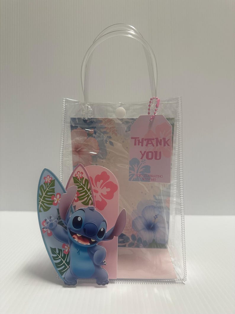 May include: A clear plastic gift bag with a handle, containing a pink tag that says "THANK YOU". A blue cartoon character with a surfboard stands in front of a pink and floral background.