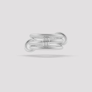 May include: A silver-toned ring featuring a multi-band design with three horizontal bars connected by two circular side loops. The central section of the ring is composed of three parallel bands held together by a vertical triple-ribbed accent.