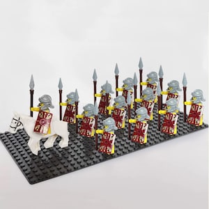 May include: A collection of plastic building block figures depicting a Roman legion with a white horse and a rider, followed by fourteen infantry soldiers. Each figure wears a grey helmet, yellow torso, and carries a brown spear and a red shield.
