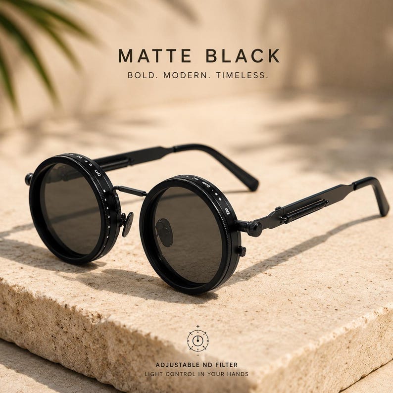 May include: Matte black sunglasses with circular lenses and an adjustable ND filter. The image text reads: BOLD. MODERN. TIMELESS. and ADJUSTABLE ND FILTER LIGHT CONTROL IN YOUR HANDS.