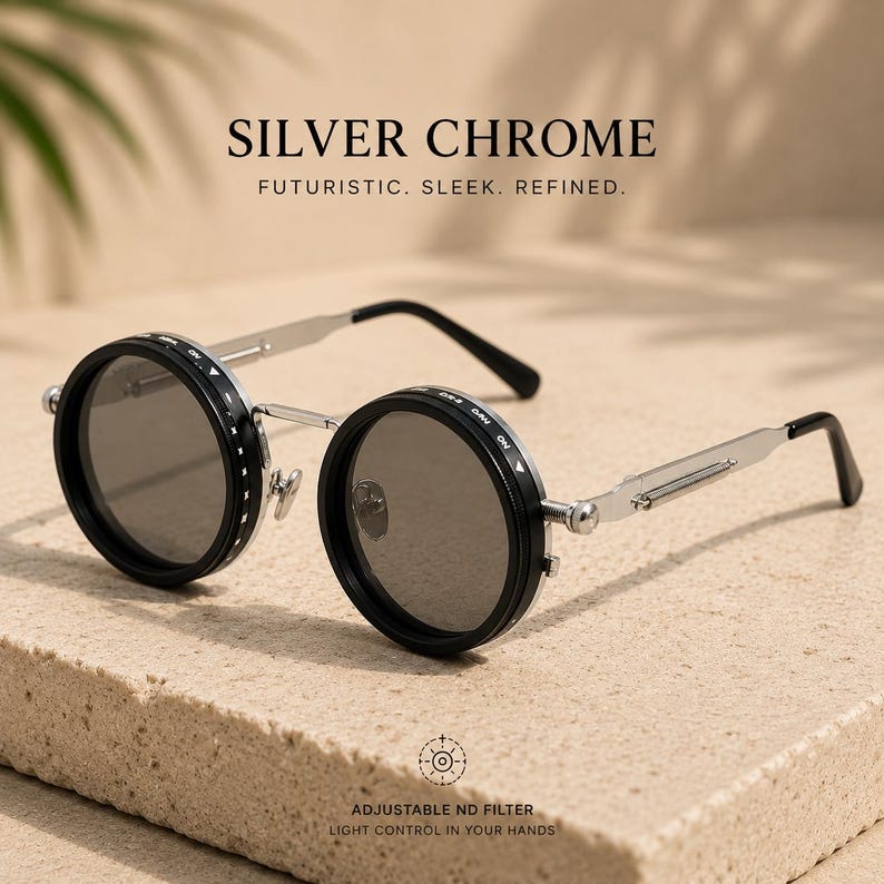 May include: Silver Chrome sunglasses with round, black frames and silver arms. The text "SILVER CHROME" and "FUTURISTIC. SLEEK. REFINED." are displayed above the sunglasses. The text "ADJUSTABLE ND FILTER LIGHT CONTROL IN YOUR HANDS" is displayed below the sunglasses.