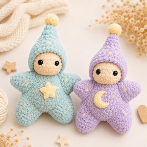 May include: Two crocheted star-shaped dolls with beige faces and black eyes. One doll is light blue with a yellow star appliqué and a matching hat with a pom-pom. The other is lavender with a yellow crescent moon appliqué and a matching hat.