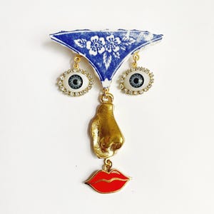 Ode to the master face brooch
