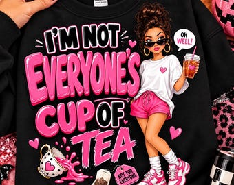 May include: A black sweatshirt featuring a graphic of a person in a white t-shirt and pink shorts holding a drink. The text reads I'M NOT EVERYONE'S CUP OF TEA and OH WELL. A spilled teacup and a tea bag tag labeled NOT FOR EVERYONE are included.