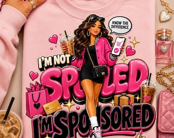 May include: A light pink sweatshirt featuring a graphic of a person in a black dress and pink jacket, holding a phone and a drink. The text reads I'M NOT SPOILED I'M SPONSORED and KNOW THE DIFFERENCE. The design includes shopping bags, a credit card, and lipstick.