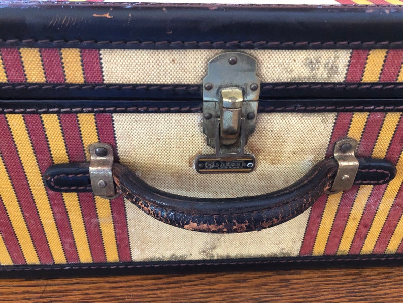 Vintage Oshkosh Stripped Luggage