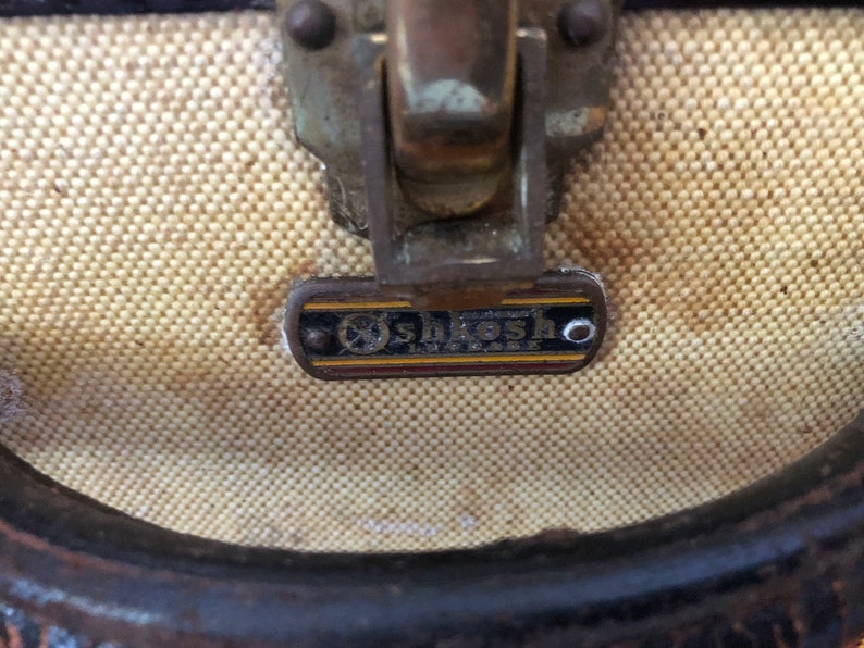 Vintage Oshkosh Stripped Luggage