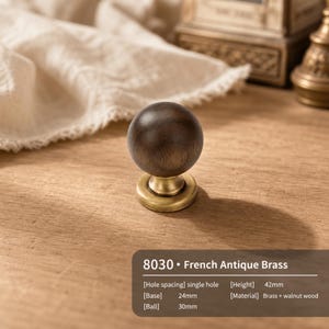 May include: A spherical dark walnut wood knob with a French antique brass base. The product is labeled 8030, with a 24mm base, 30mm ball, 42mm height, and single hole spacing. The design combines wood and brass materials for a functional cabinet pull.