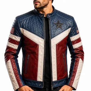 May include: A blue, white, and red leather jacket featuring a quilted texture on the upper chest and shoulders, a dark star emblem on the left chest, a full-length front zipper, and small American flag patches on both sleeves.
