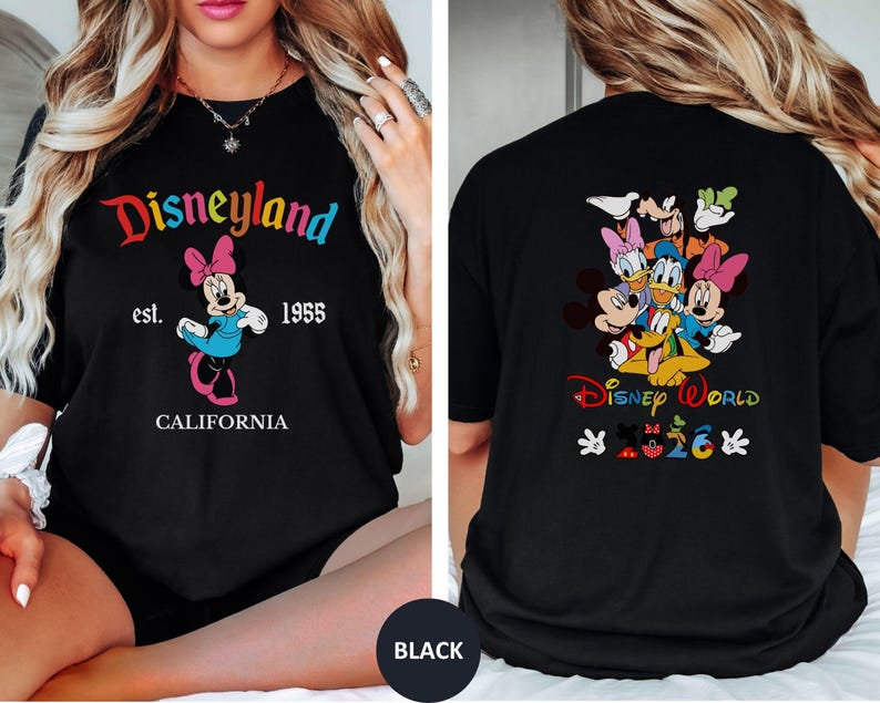 May include: A black t-shirt featuring a front graphic of Minnie Mouse with the text Disneyland est. 1955 CALIFORNIA. The back graphic displays a group of Disney characters with the text Disney World 2026 and small character-themed icons.